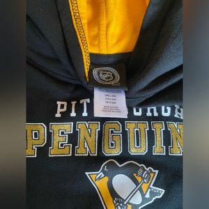 Pittsburg penguin hockey sweater.